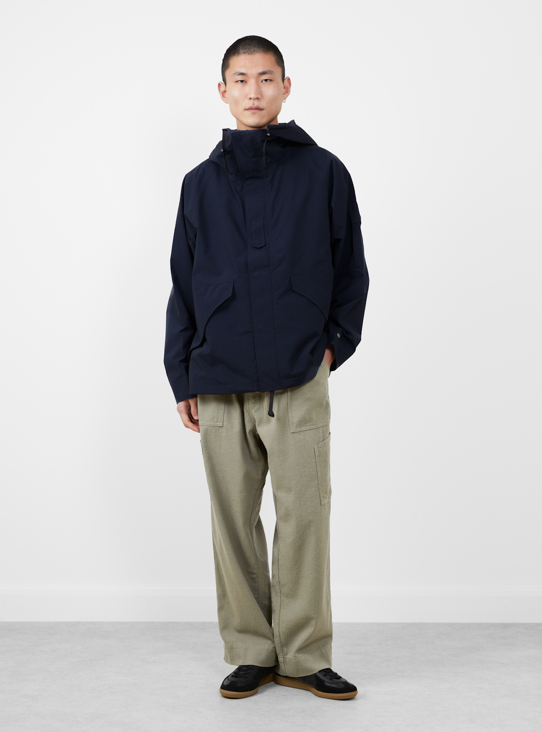 Rear view of a technical jacket showing the split-yoke shoulder construction.