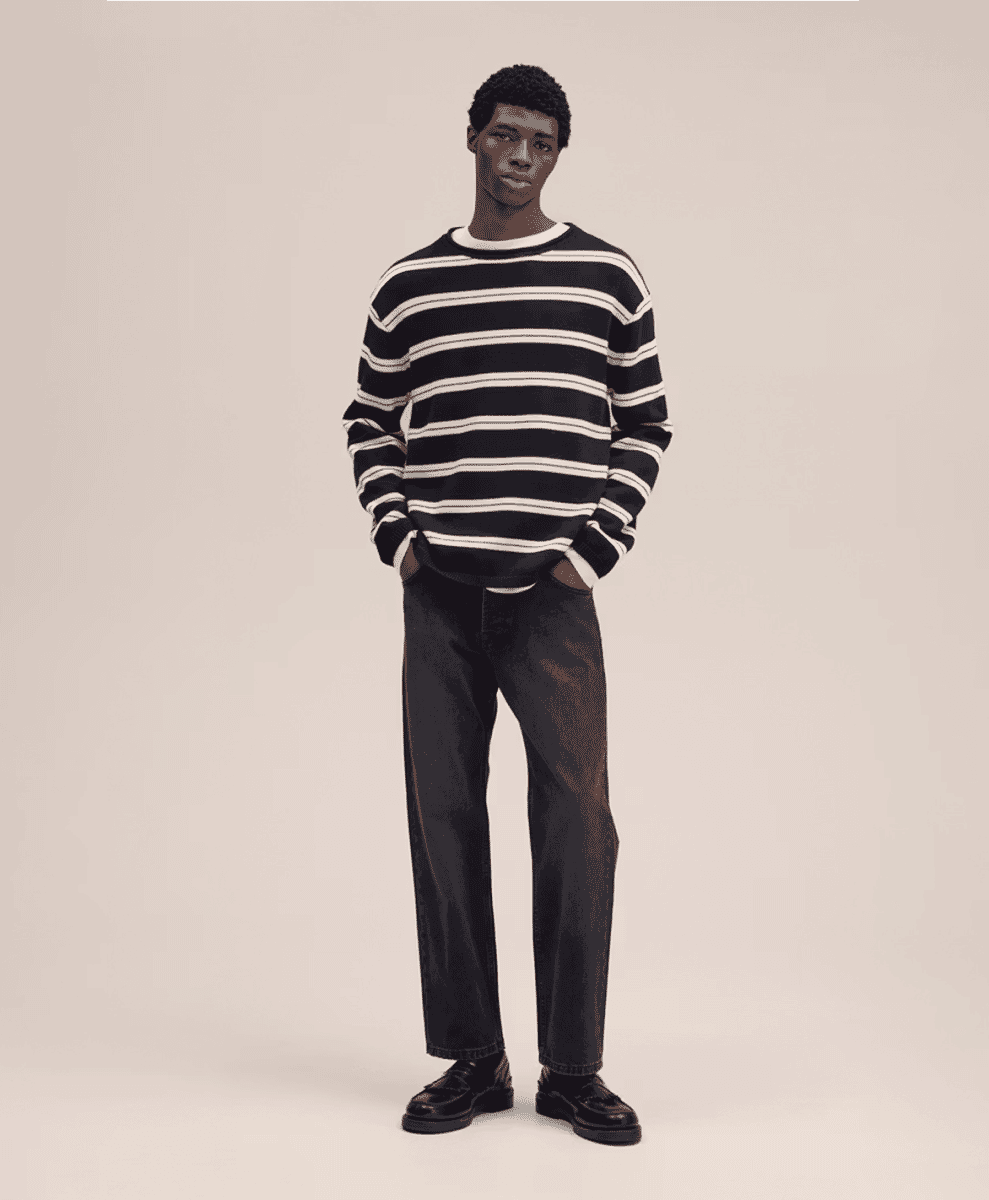 Symmetrical shot of a heavy-duty navy sailor sweater with ribbed cuffs.