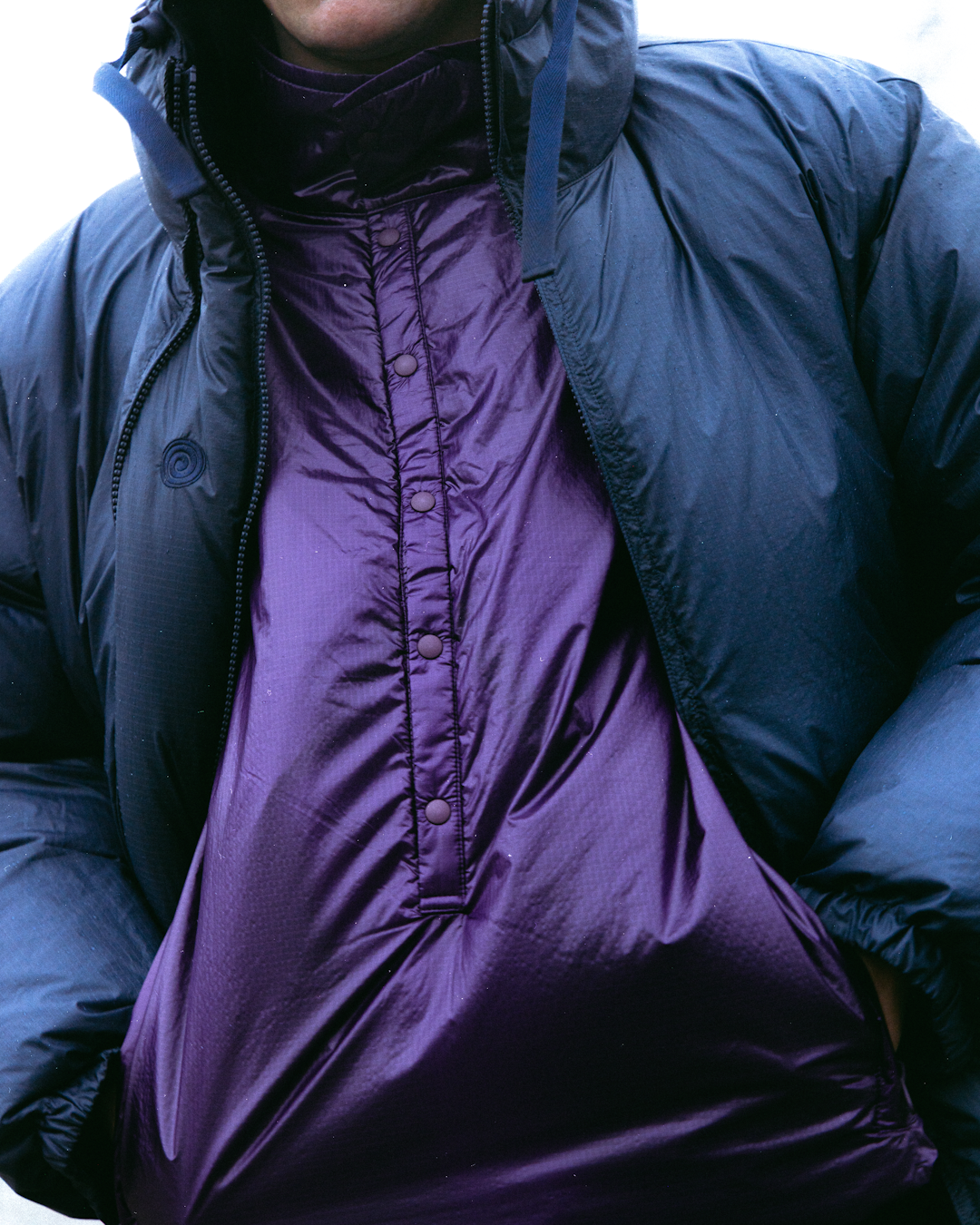 Close-up showing the significant loft and thickness of a high-fill-power parka.