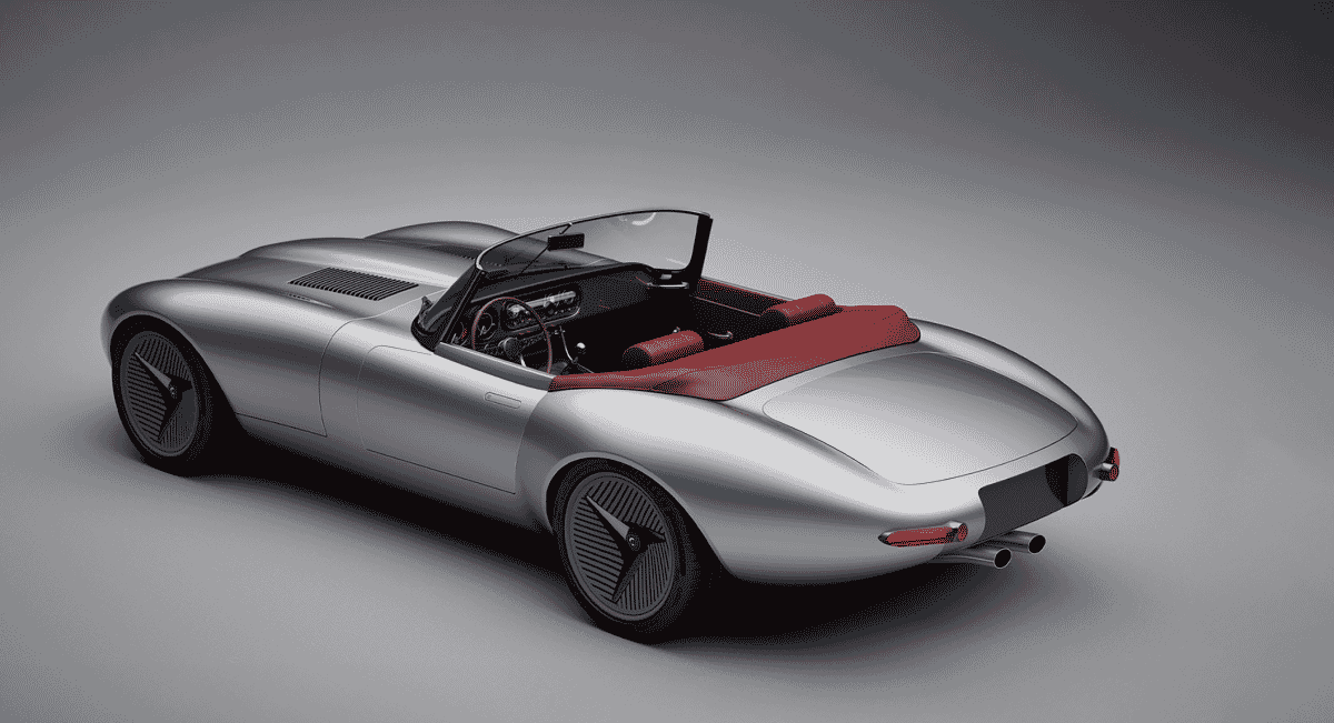 Silver Jaguar E-type Concept by Callum Design featuring a red convertible top and heritage-inspired design.
