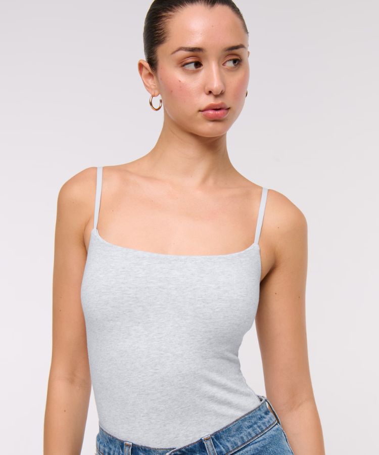 Simple black 90s style camisole with thin straps.