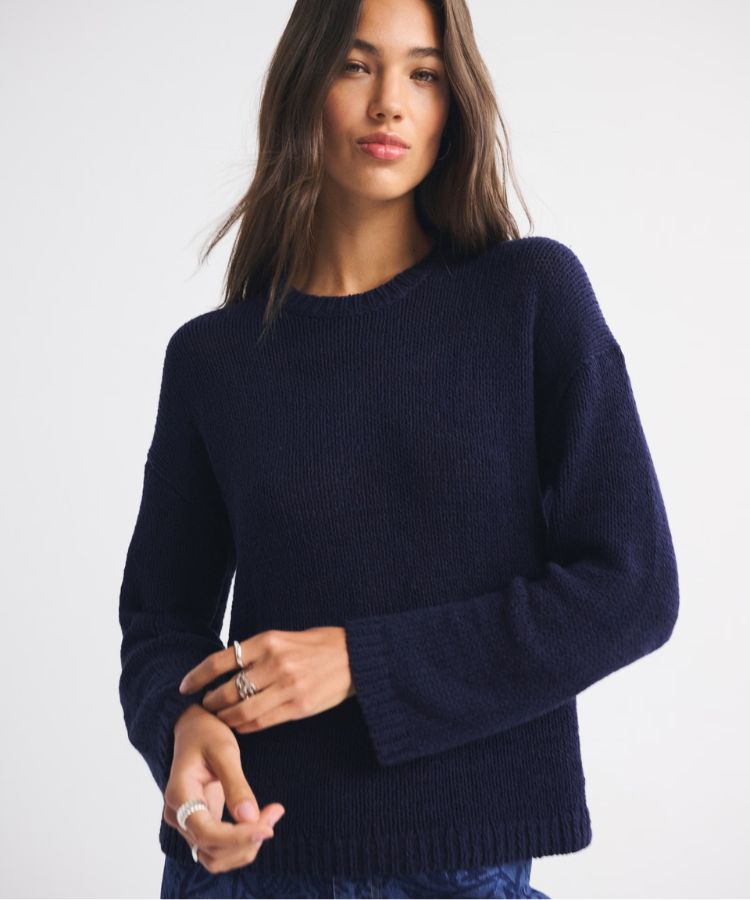 White open-stitch textural crew neck sweater.