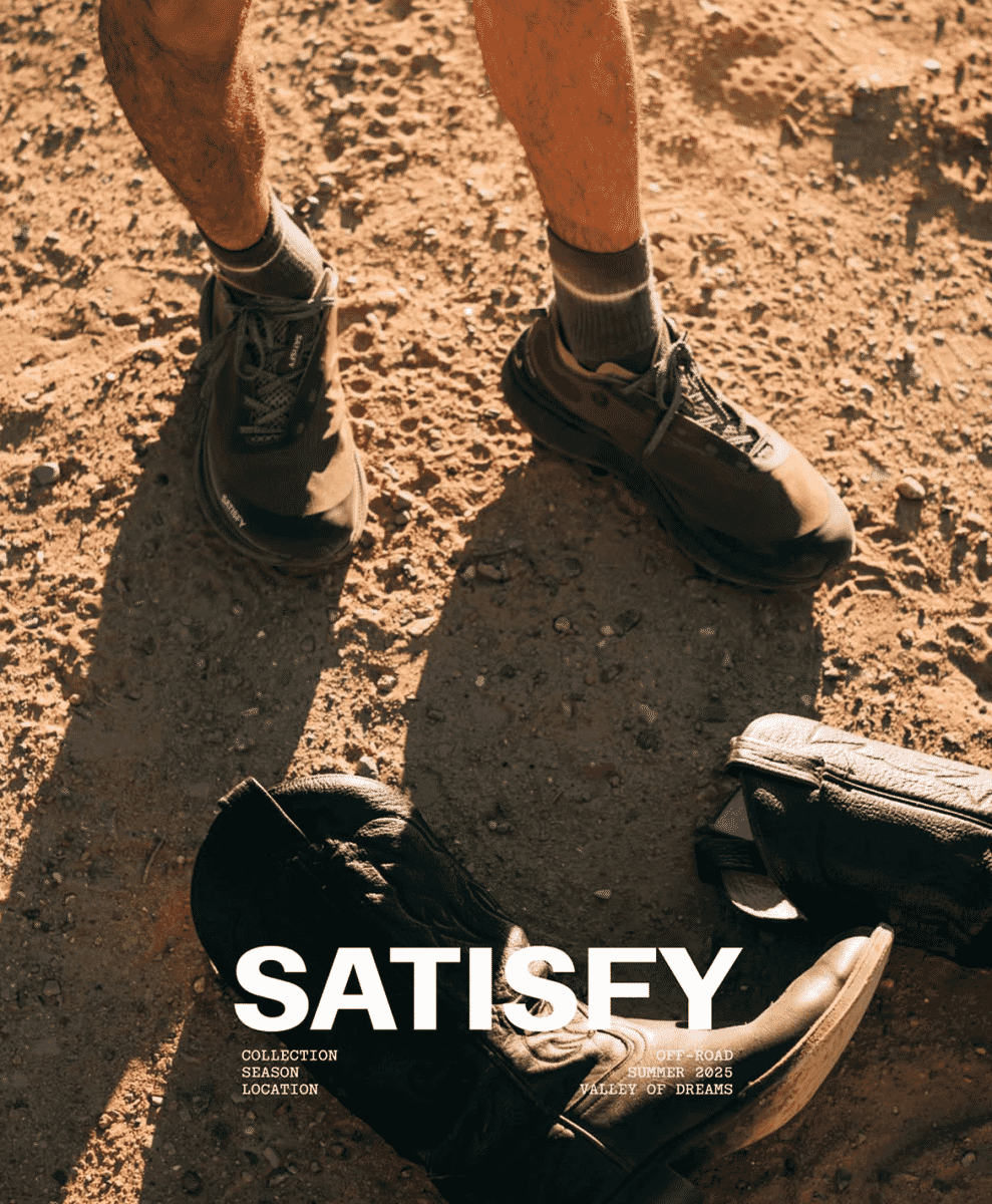 Close-up of hiking shoes on dusty off-road terrain in the Valley of Dreams.
