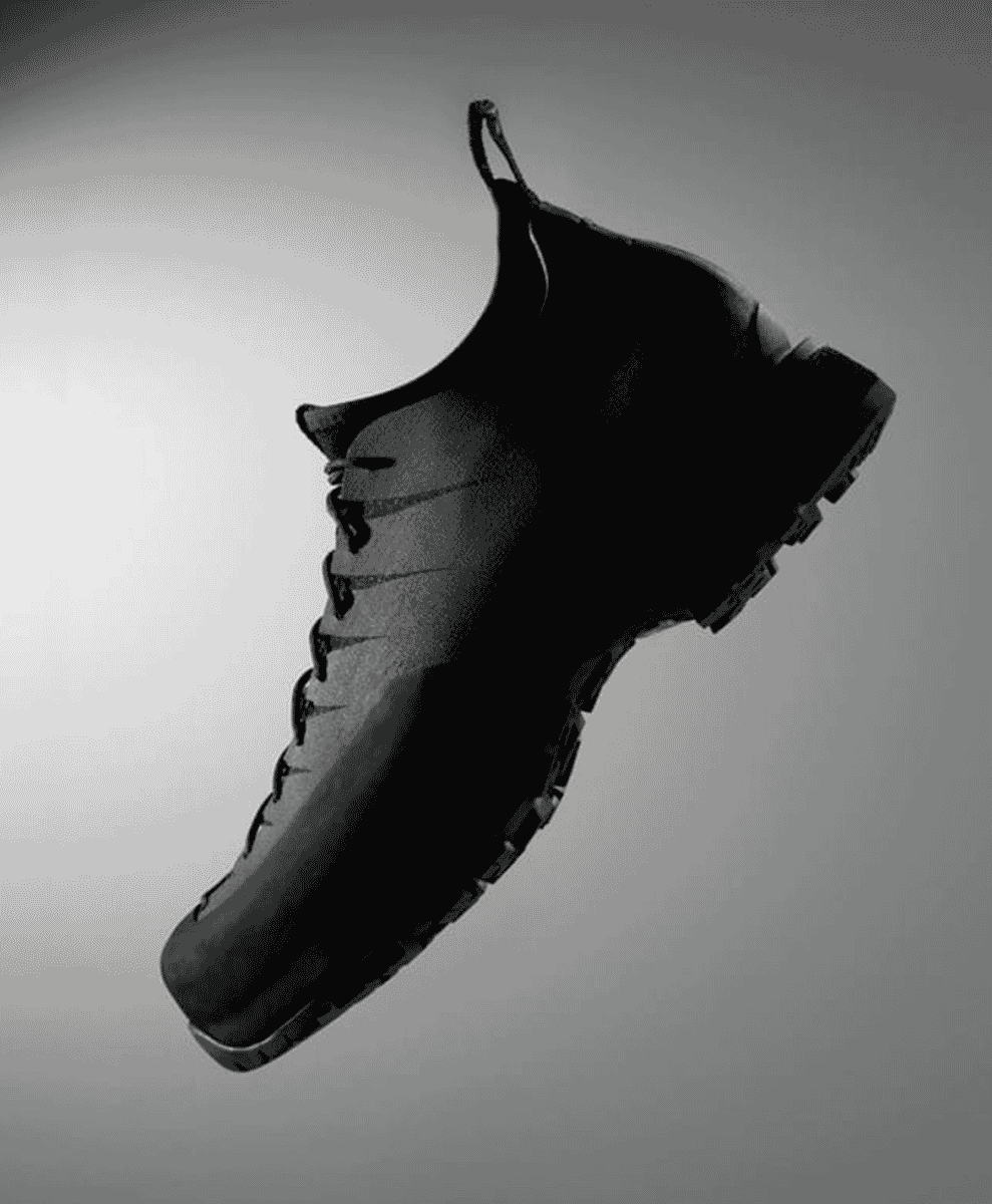 Detailed view of the aggressive Vibram outsole tread and the layered microporous midsole.