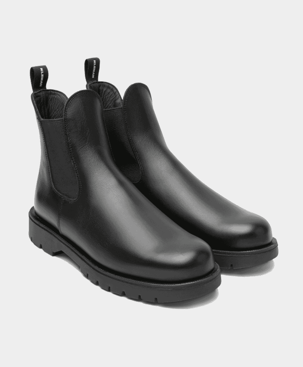 Black leather chunky Chelsea boots with elastic side panels.