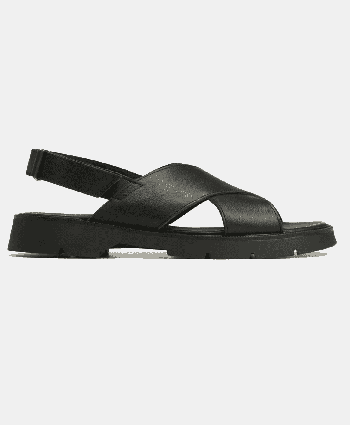 A lifestyle-focused shot of seasonal sandals and shoes in a bright, outdoor spring setting.