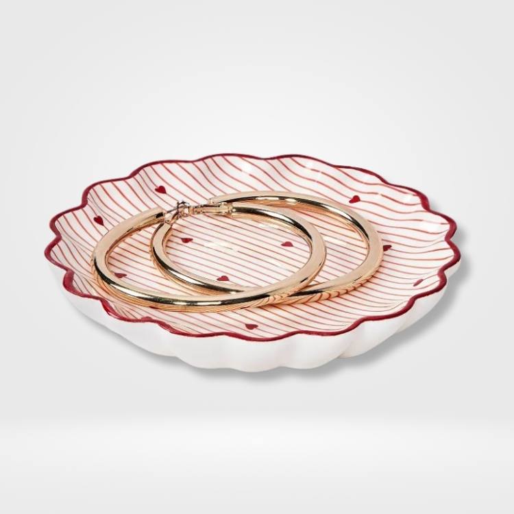 Scallop-edged heart-shaped ceramic tray in pink.