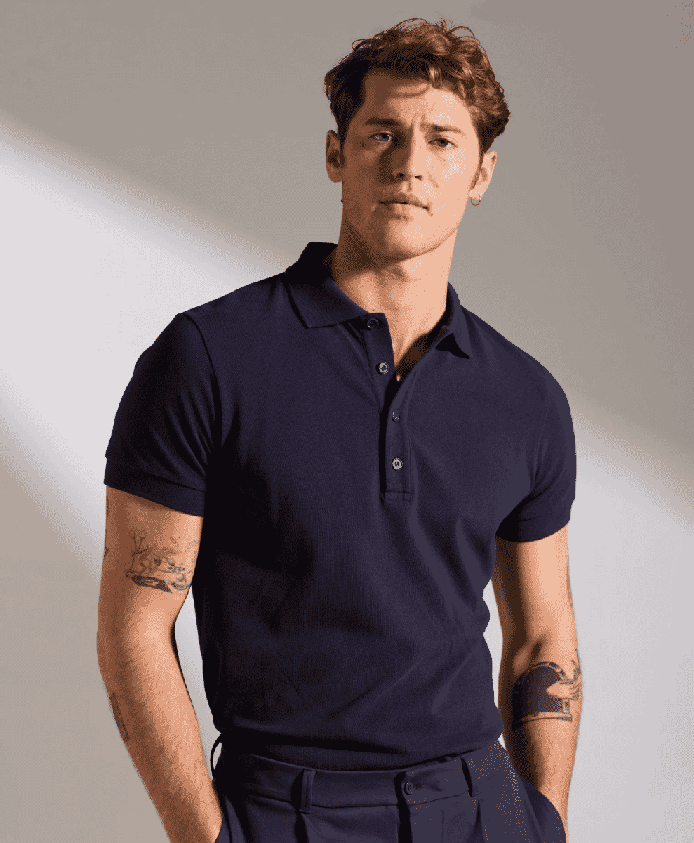 Man wearing a navy blue short-sleeve polo shirt with a ribbed texture.