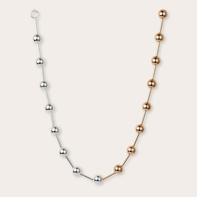 A two-tone Celeste Necklace blending silver and gold elements.