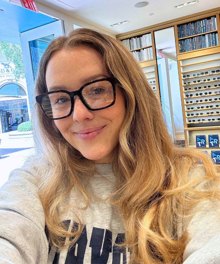 Kirra Wallace wearing stylish eyewear in a lifestyle setting.