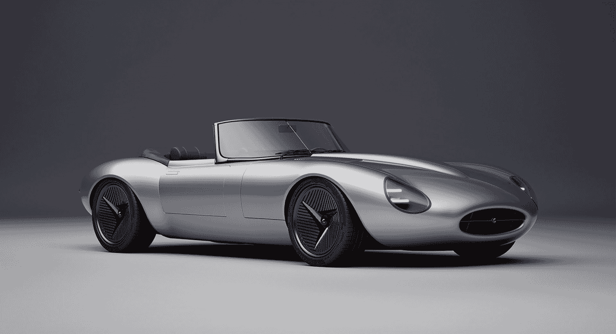 Front-three-quarter view of the silver Jaguar E-type Concept highlighting its futuristic curves and LED lighting technology.