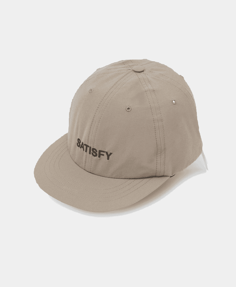 Beige Satisfy embroidered baseball cap for outdoor performance.