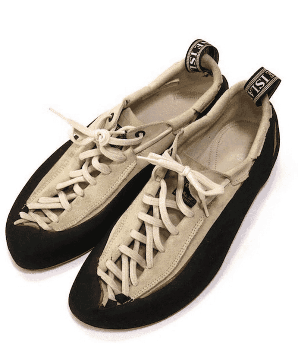 La Sportiva x Stone Island suede leather approach shoe with the Stone Island compass logo detail.