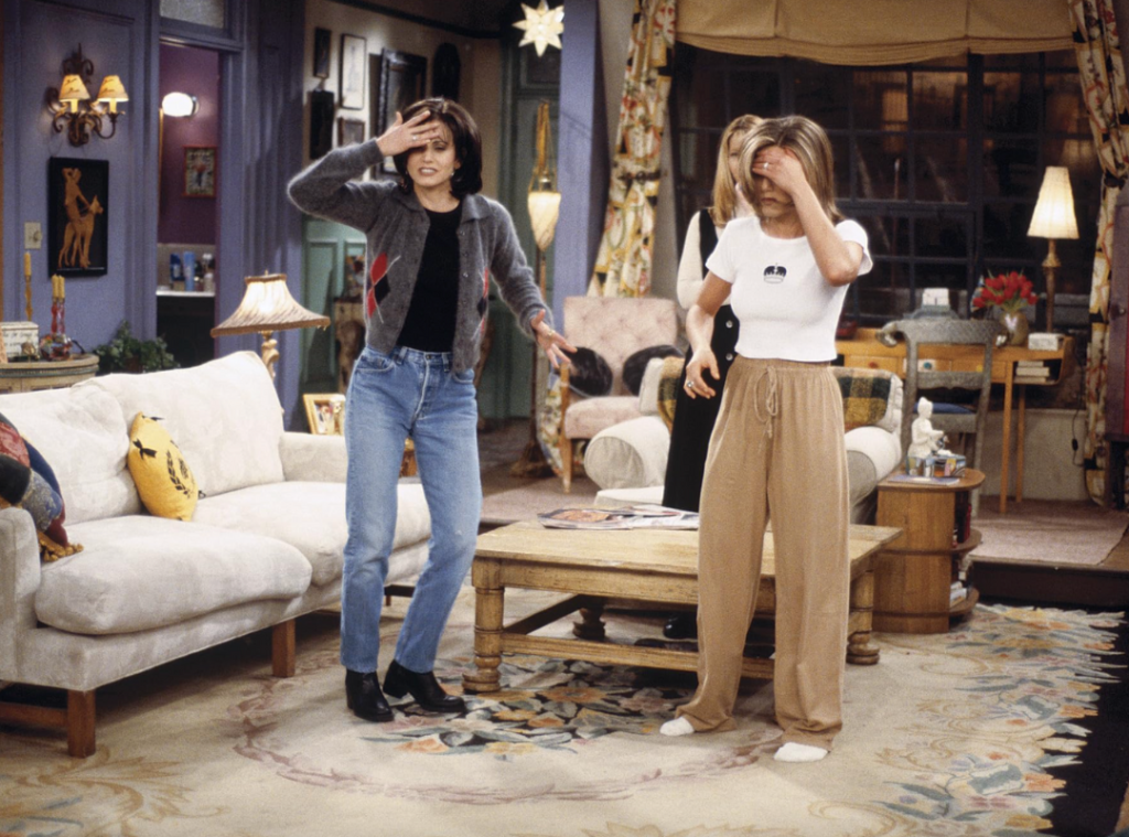 Still of Monica Geller wearing a fitted preppy cardigan.