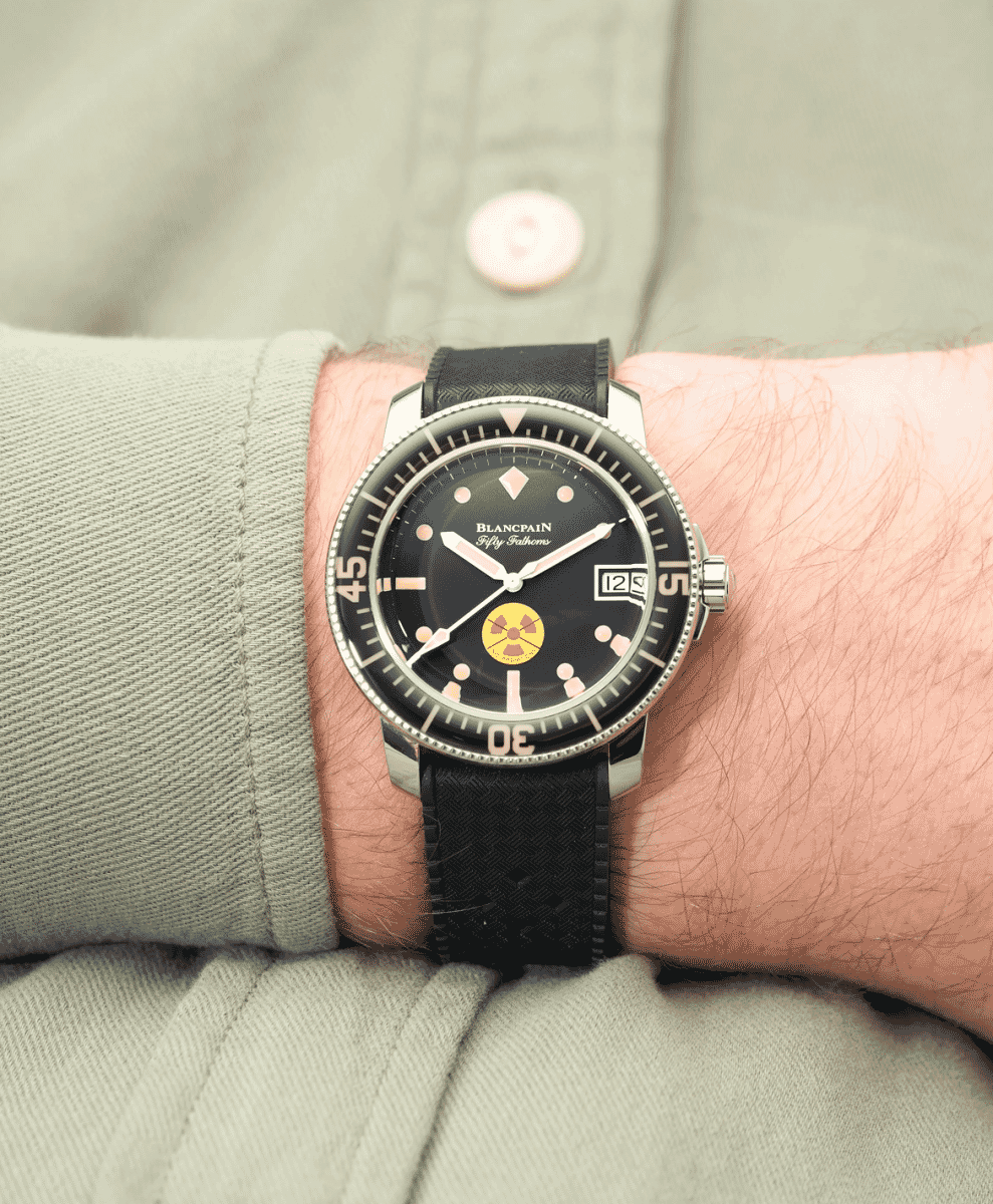 Macro detail of a luxury watch dial focusing on the mechanical craftsmanship and lume markers.