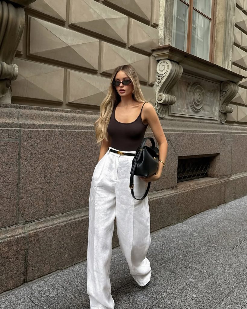 A monochromatic blazer and wide leg pants outfit.