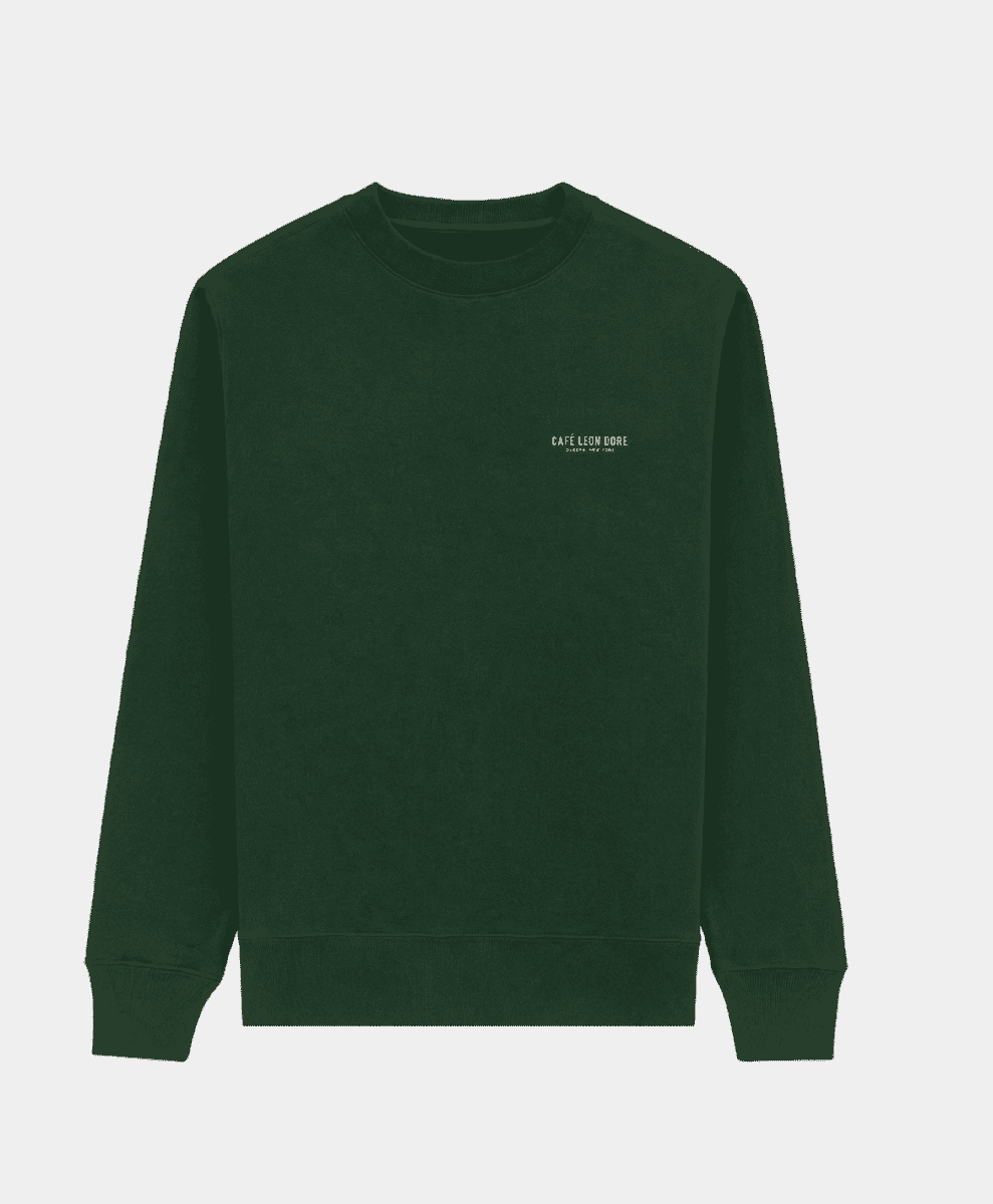 A dark green crewneck sweatshirt with white Café Leon Dore embroidery.