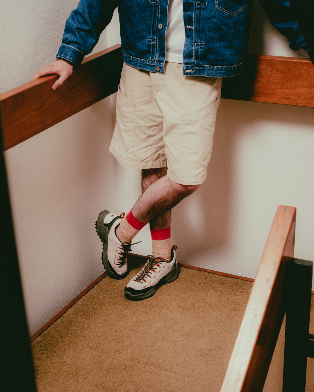 Lifestyle shot of KEEN SS26 footwear in a sun-drenched, minimalist modernist interior.
