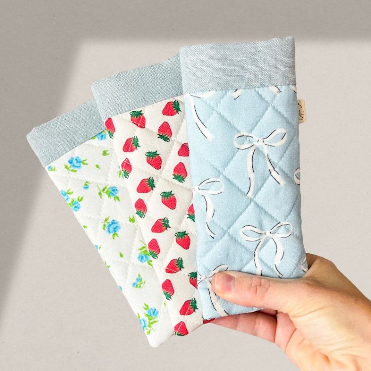 Quilted fabric glasses case in a soft blue color