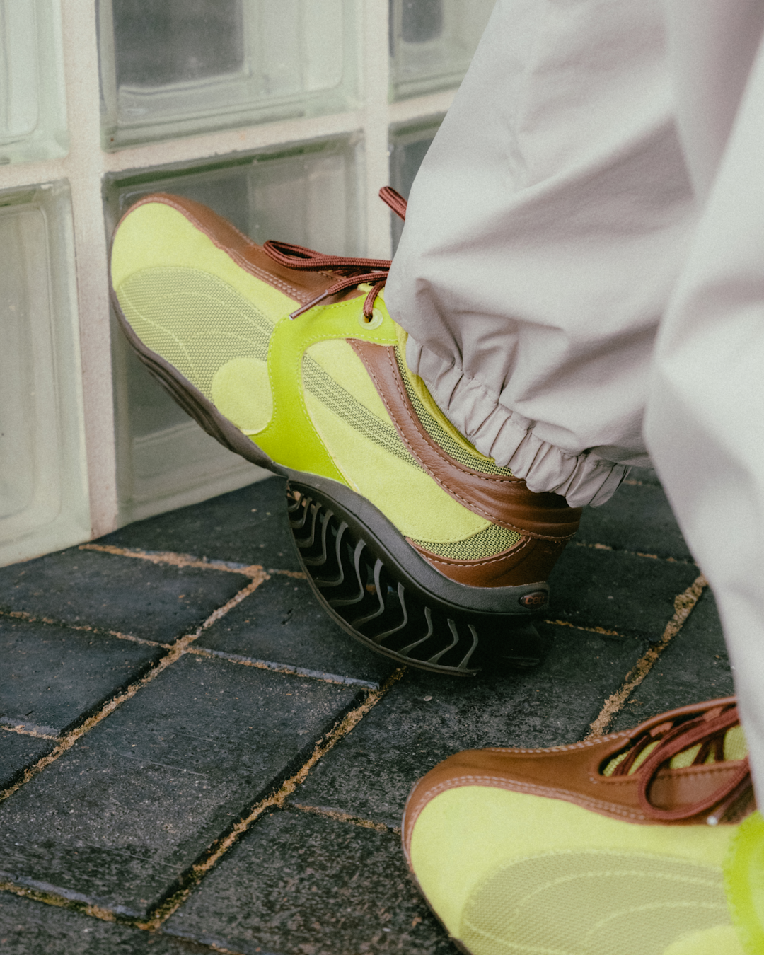Lifestyle shot of PUMA CELL Geo sneakers styled with technical trousers for a technical lifestyle look.