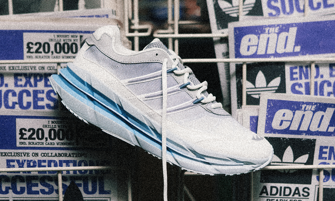 The adidas sneaker displayed against a newspaper backdrop featuring a £20,000 prize headline.