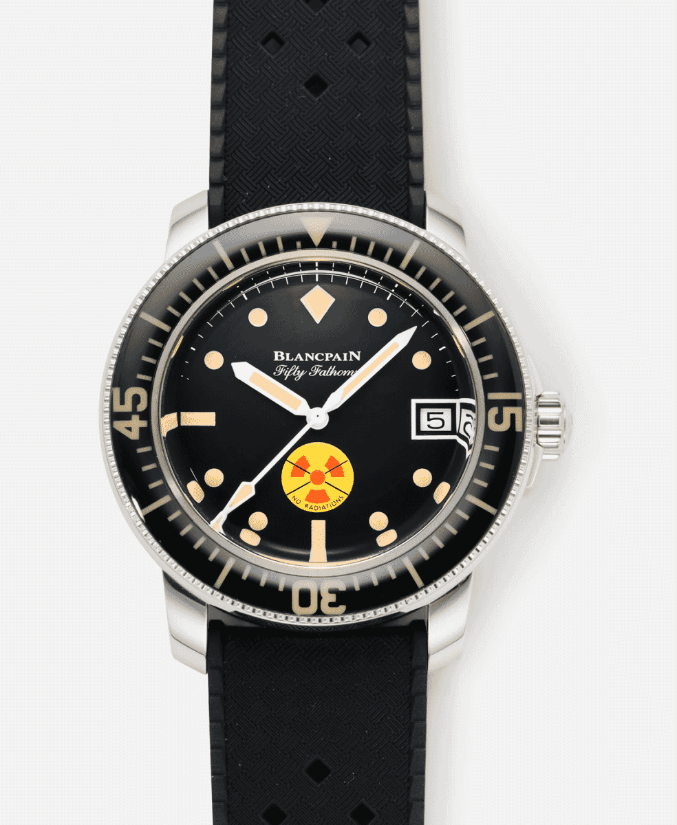Close-up of the Blancpain Fifty Fathoms No Rad dial showing the yellow and red radiation-free symbol and the rotating dive bezel.