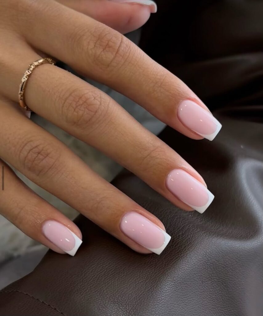 Manicure featuring a sheer, milky pink 'your nails but better' finish.