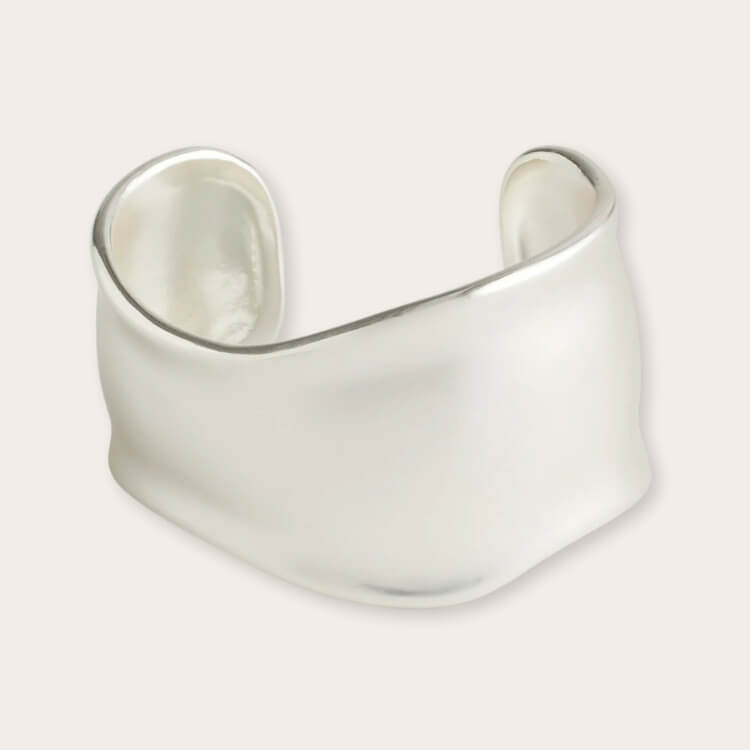 A thick, chunky silver cuff bracelet from Madewell.