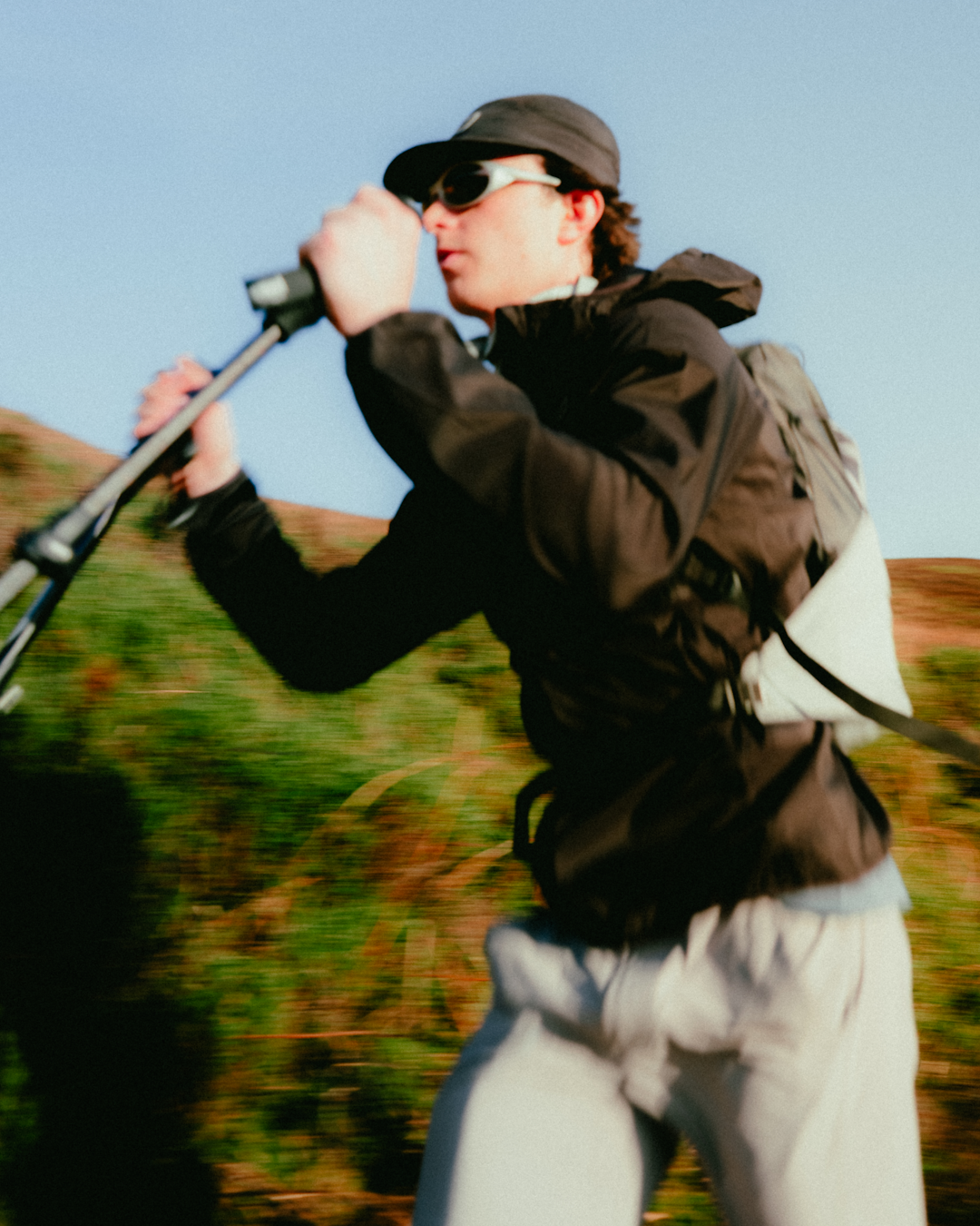 Macro shot of a soft flask in the chest pocket and Z-poles attached to the exterior of the pack.