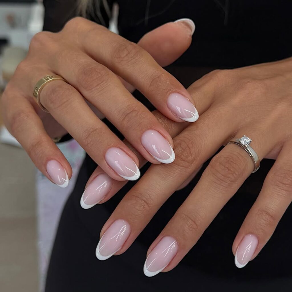 Glossy almond-shaped manicure with a clean girl aesthetic.