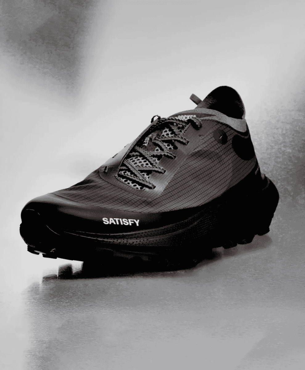 Close-up shot of Satisfy TheRocker sneaker focusing on the technical lacing and minimalist branding.