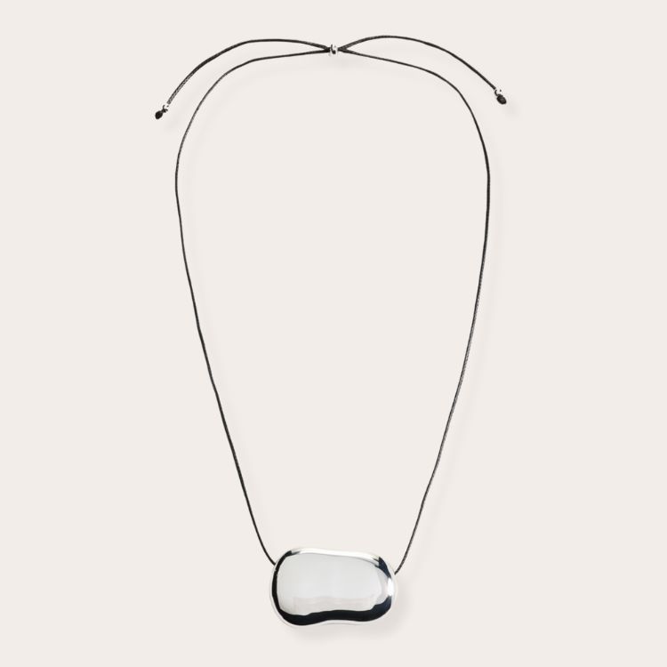 A minimalist silver Julia Necklace with a unique sculptural pendant.
