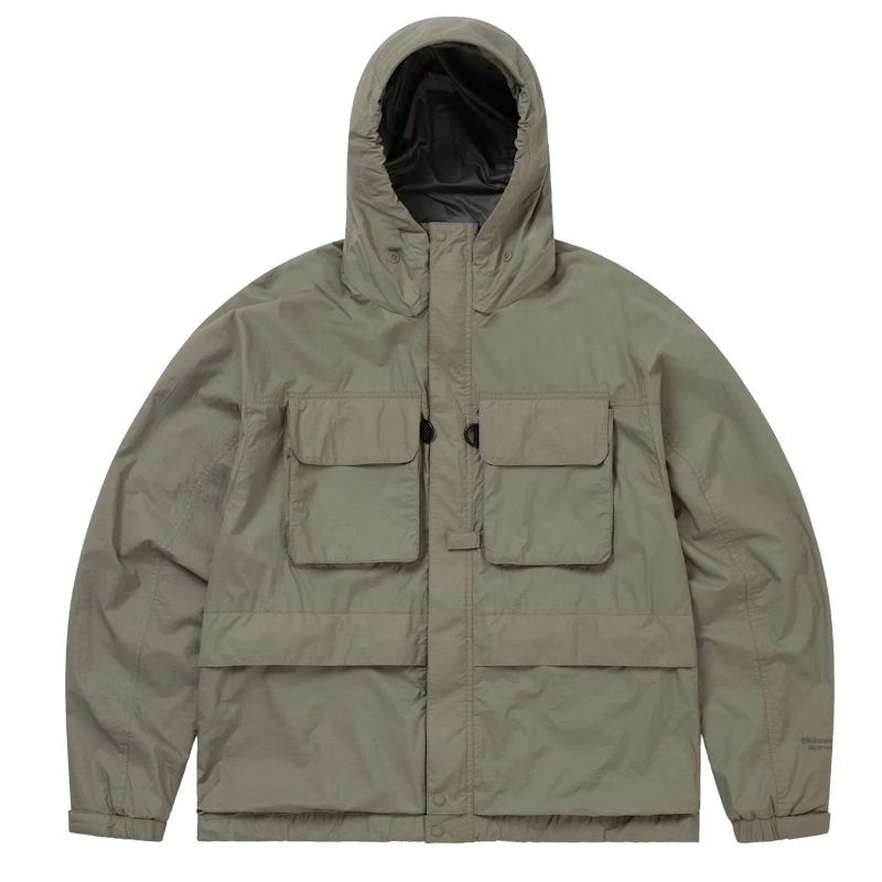 Close-up detail of a waterproof zipper and technical fabric on a Nanamica shell jacket.