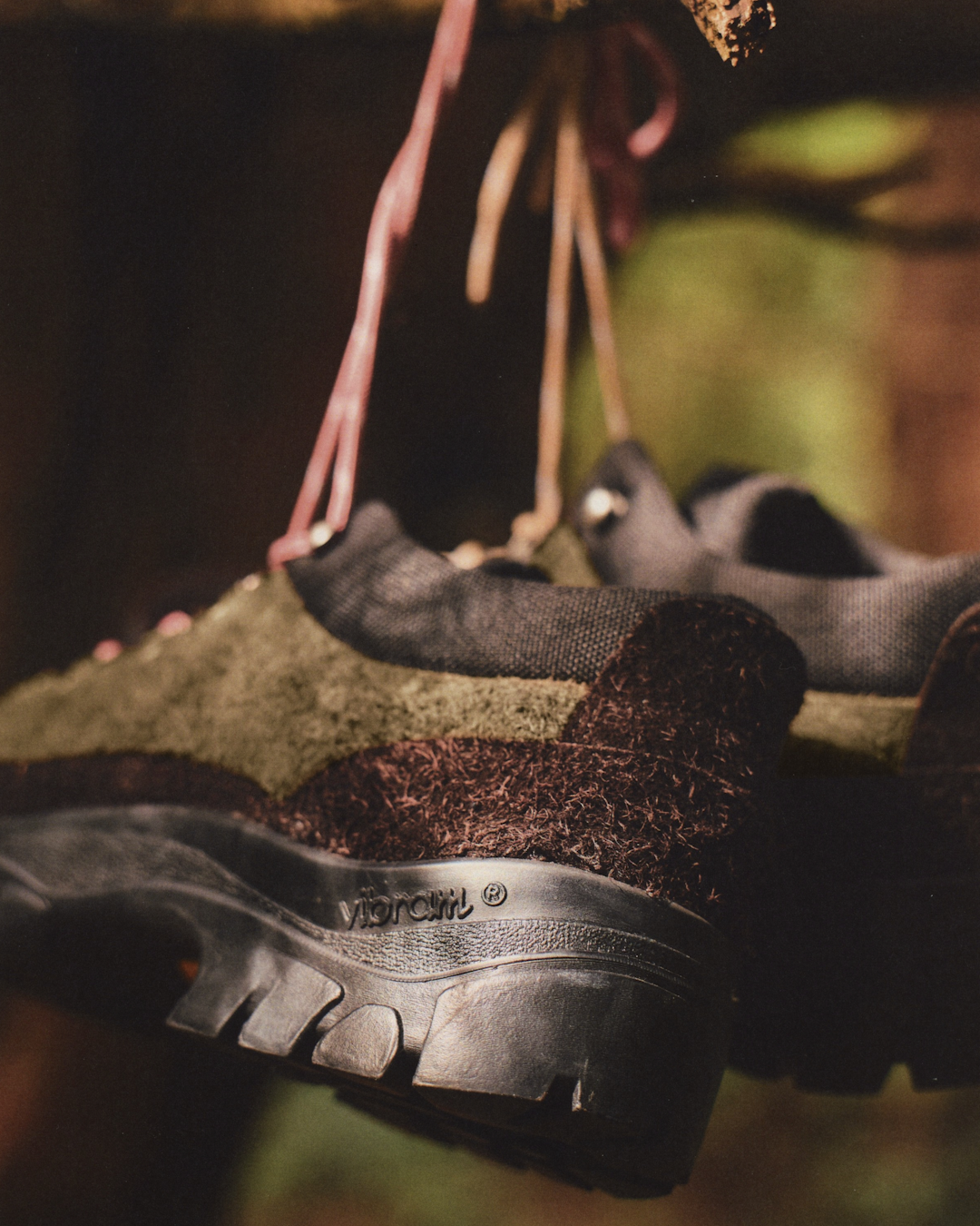 Macro detail shot showing the texture of multi-tonal hairy suede overlays on the shoe upper.