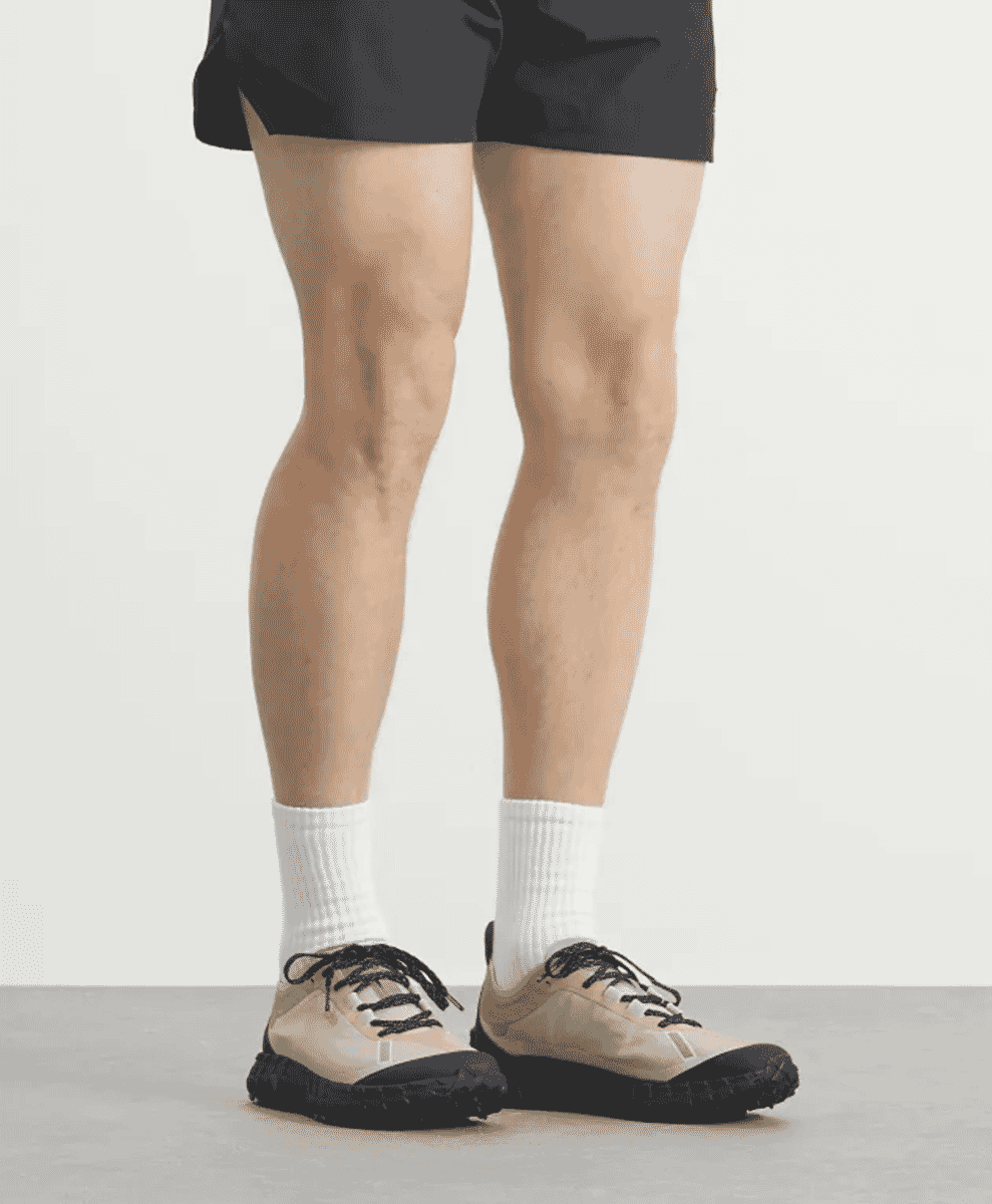 Side view of Norda 001 technical trail runner featuring white Dyneema mesh and Vibram sole.