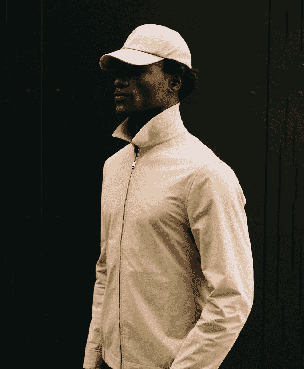 Lifestyle shot of a passenger wearing the LESTRANGE 360 Jacket comfortably during travel, emphasizing its crease-resistant nature.