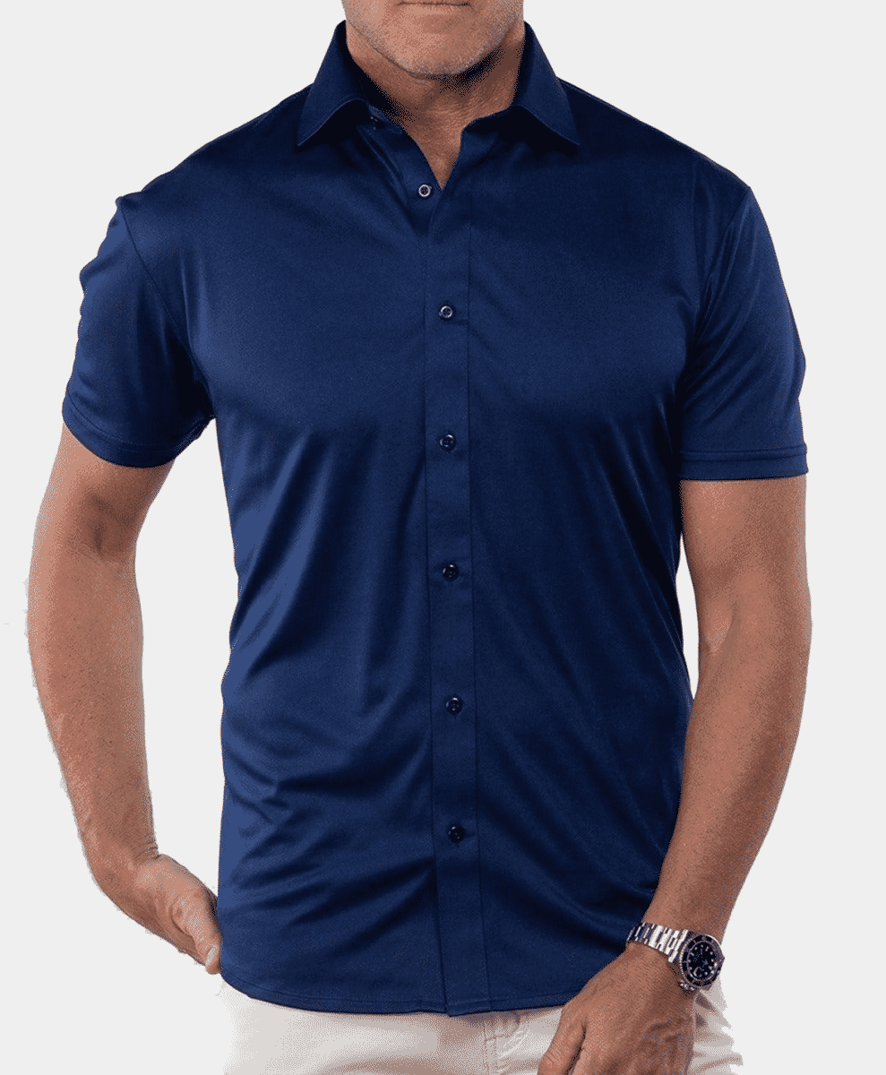 Man modeling a navy blue short-sleeve button-up shirt with a tailored fit.