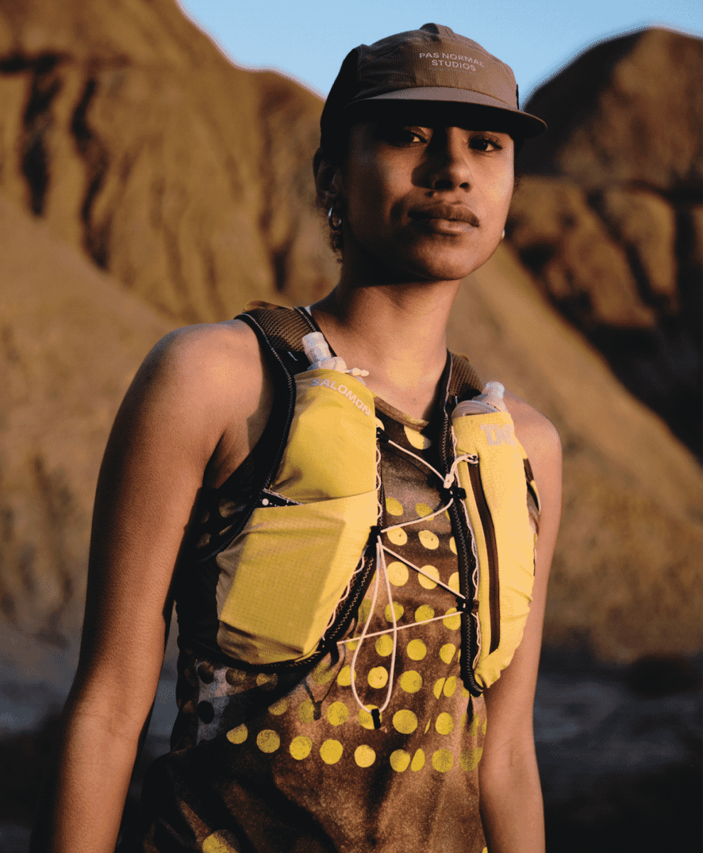 Rear view of the hydration vest showing storage compartments and minimalist branding.