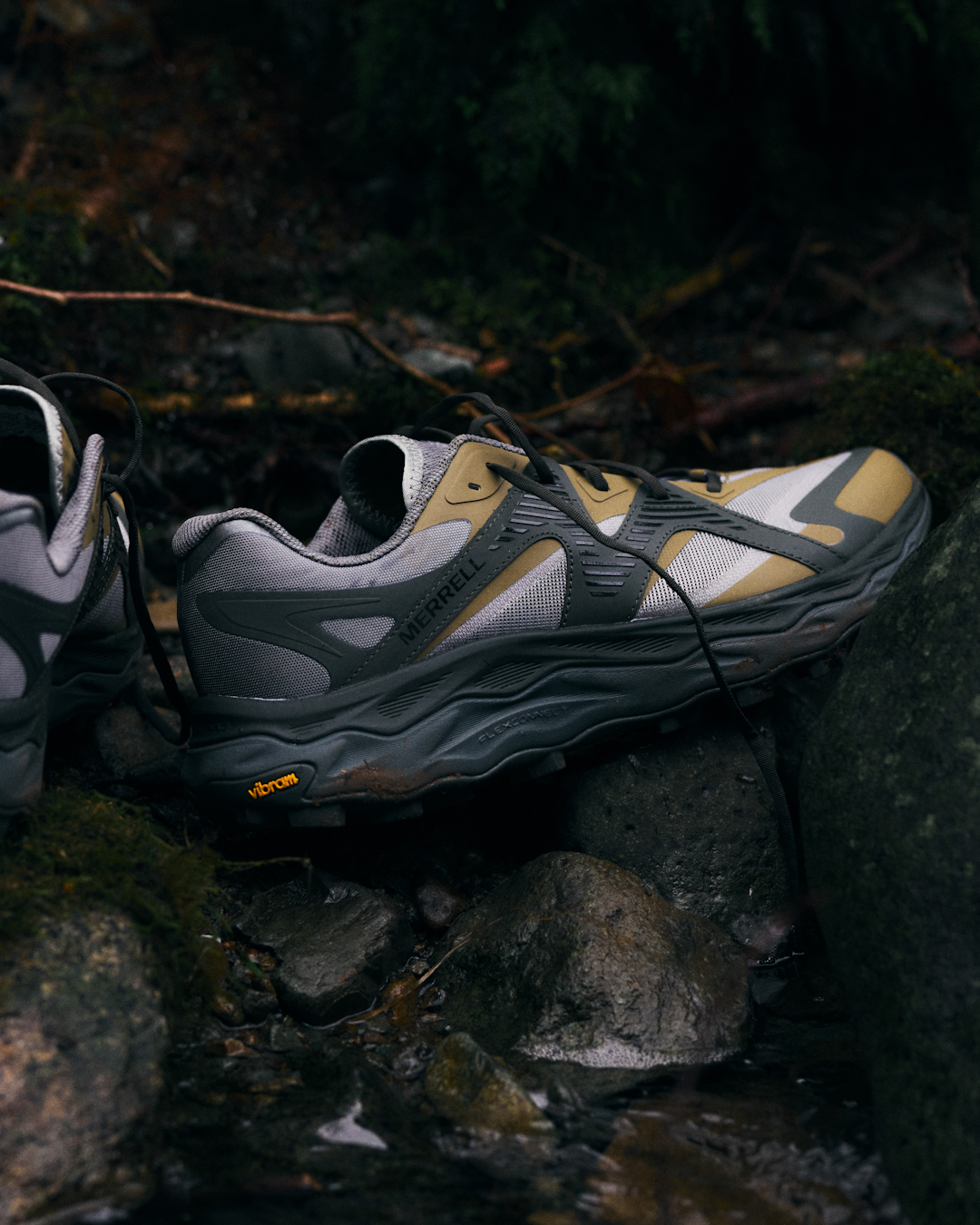 Action shot of the Merrell Agility Peak 6 in motion on a rocky trail.
