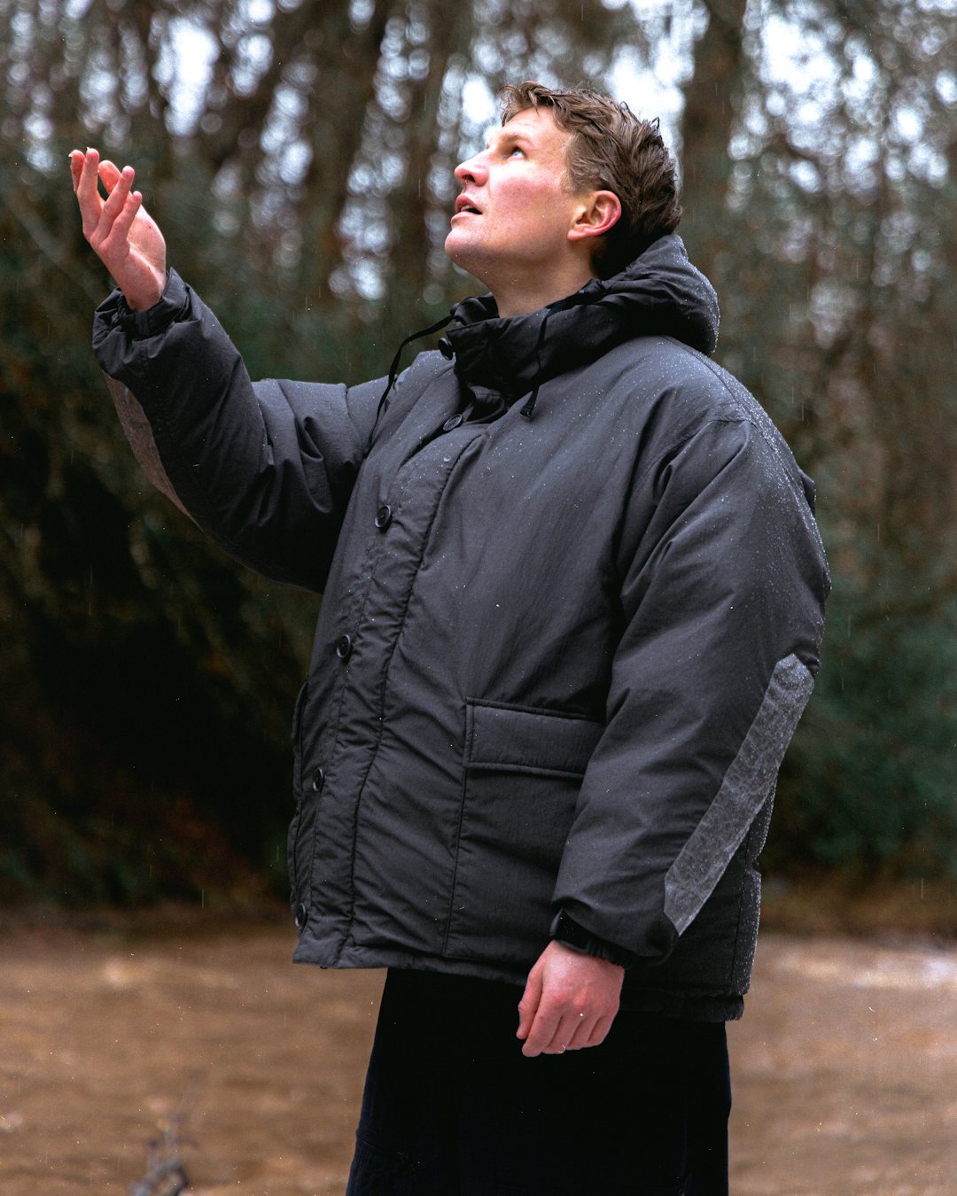 A layered look featuring a down cardigan worn under a larger shell parka.