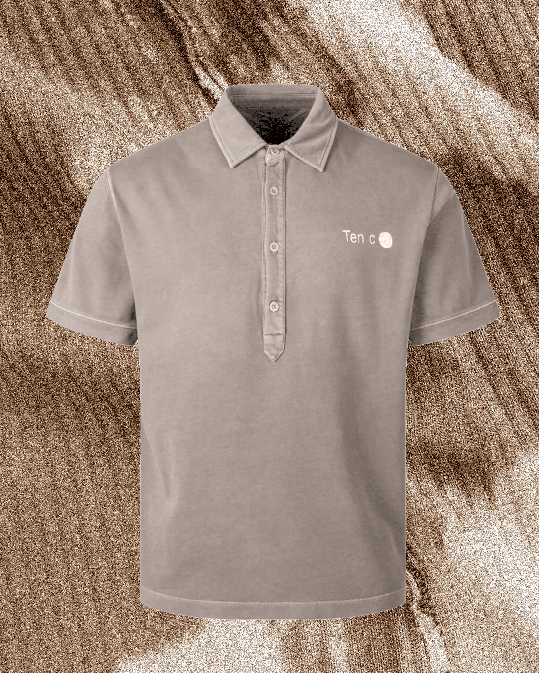 Light gray Ten c polo shirt with logo detail and classic button collar.