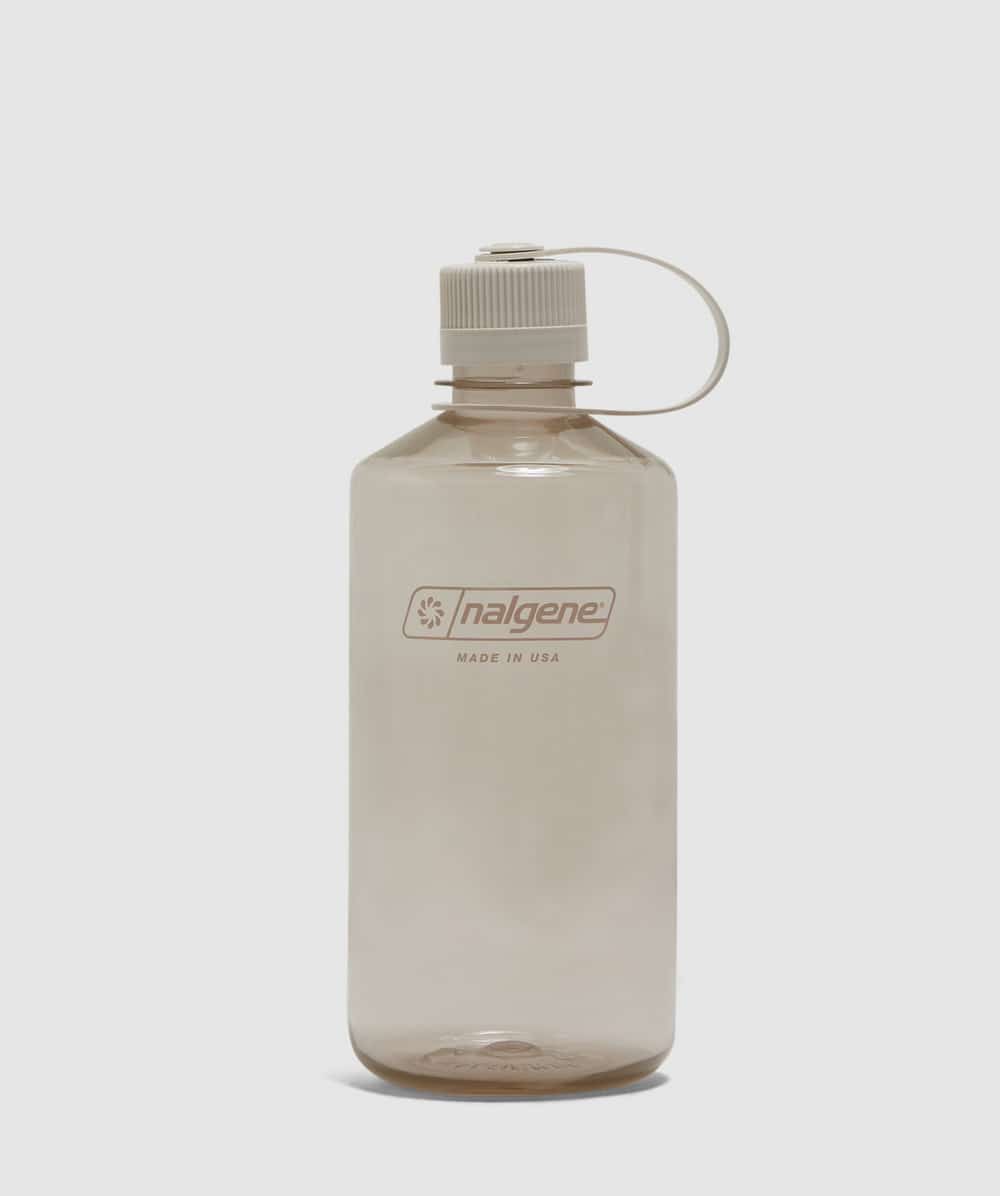 A minimalist translucent beige Nalgene bottle with a white cap and 'Made in USA' branding.