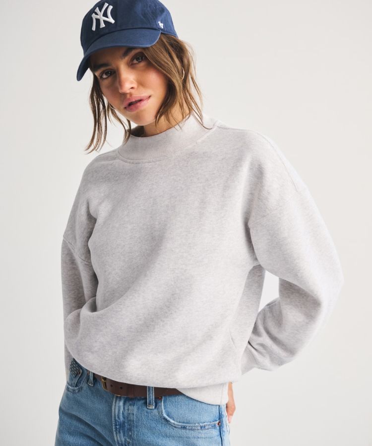 Grey Sunday mockneck sweater with a slim fit.