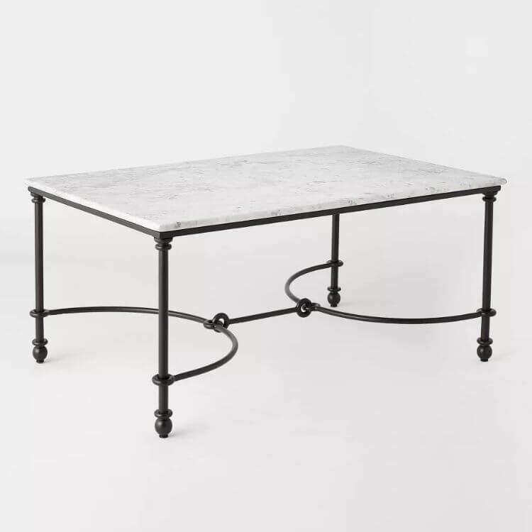 Round metal and marble coffee table with a modern minimalist design.