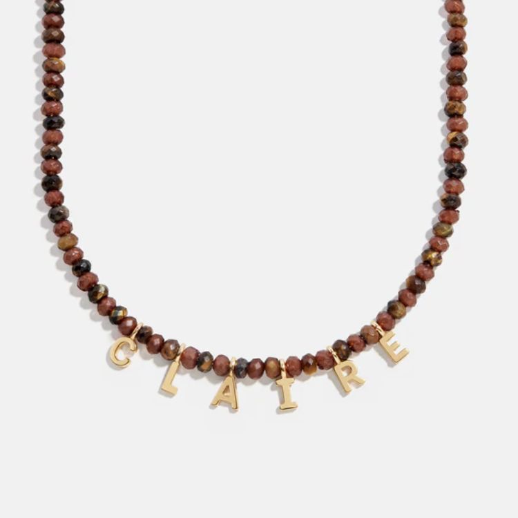 Close-up of a Mini Semi-Precious Stone Custom Necklace with a gold setting.