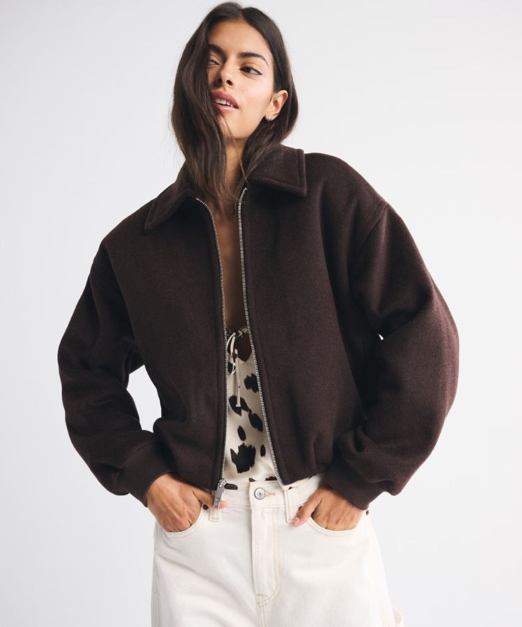 Cream-colored wool-blend coat with a gathered bubble hem.