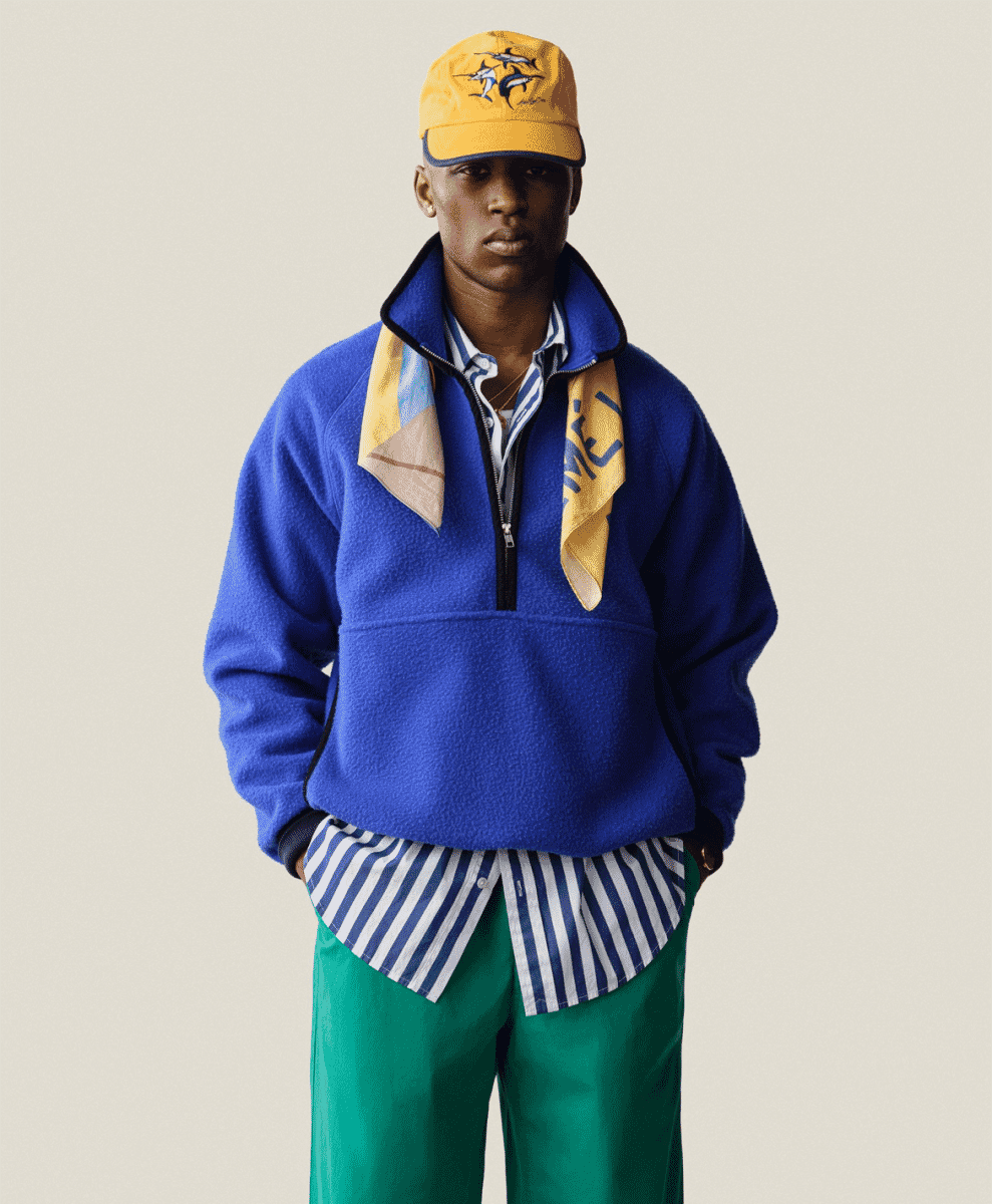 Bright yellow knitwear piece styled for warm weather.