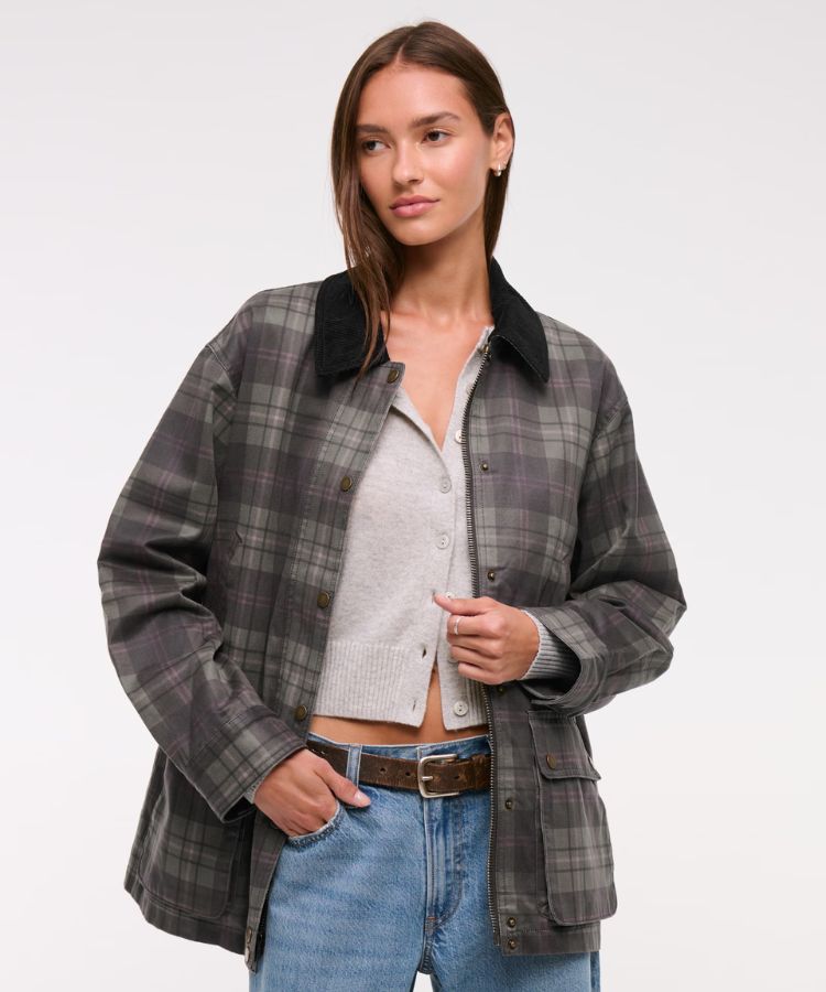 Mid-length olive waxed barn jacket with a brown corduroy collar.
