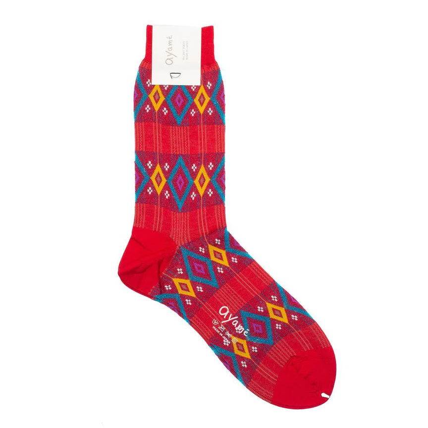 Red crew sock featuring a colorful geometric diamond pattern.