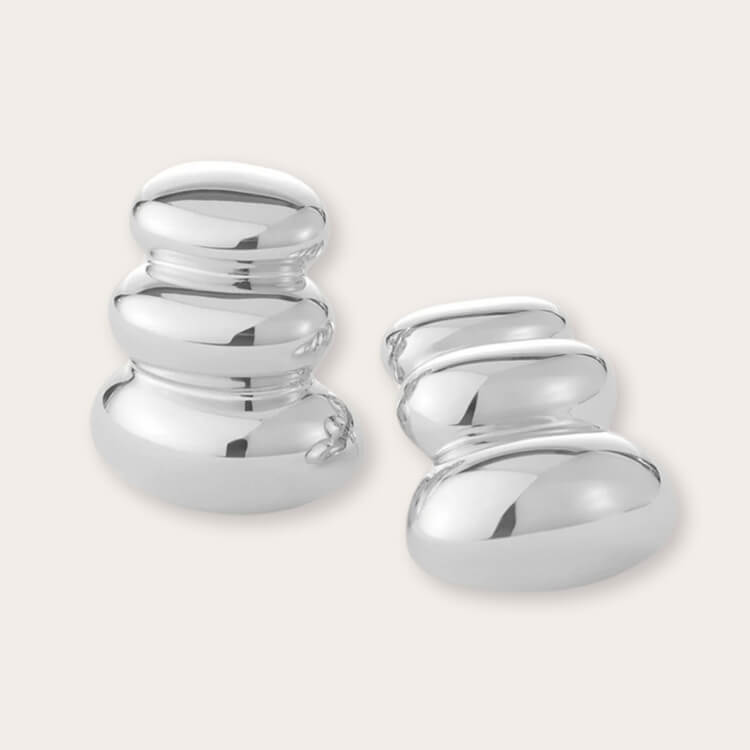 A pair of Jenny Bird Oversized Post Earrings in a high-polish silver finish.